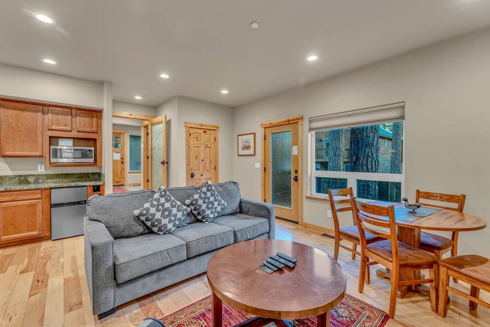 Bonus Room: 2 couches, 42” Smart TV, 4-person dining table, wet bar with microwave, mini fridge and sink, ground floor