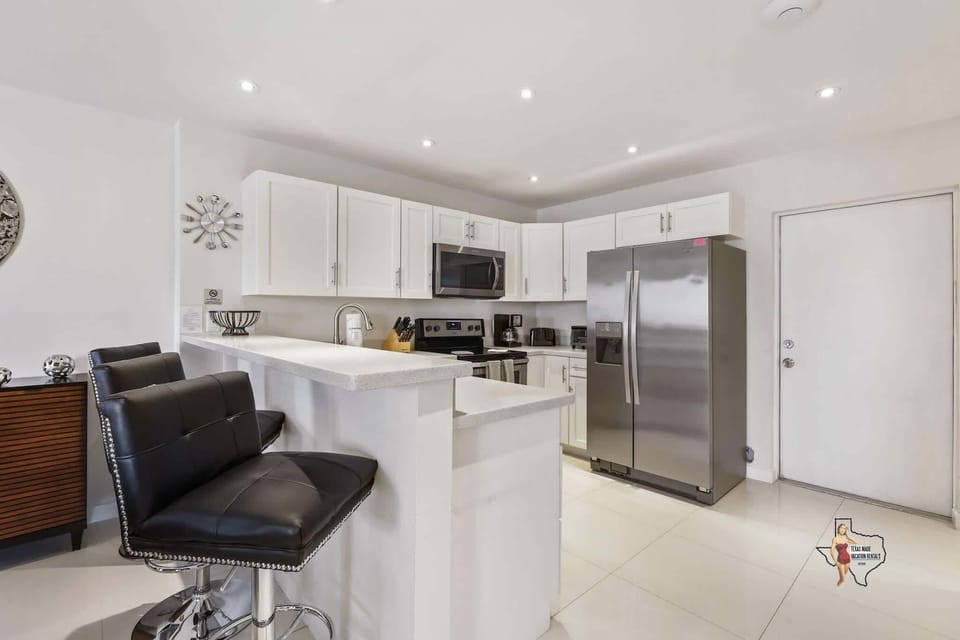 Enjoy a quick meal or morning coffee at the stylish breakfast bar.