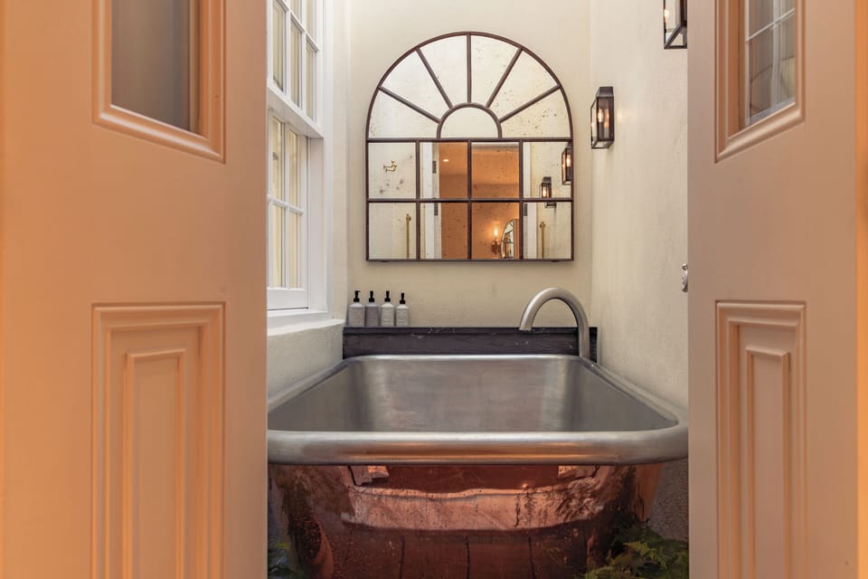 Hideout Suite | Bathroom | Hair dryer, bathrobes, slippers, towels