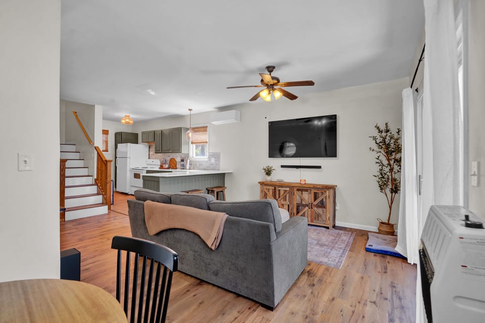 The open-concept main floor offers plenty of space to gather, dine, and enjoy time together with a view.
