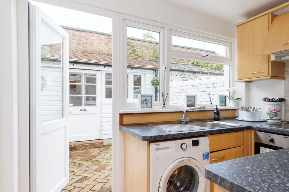 Kitchen area with door accessing the garden 