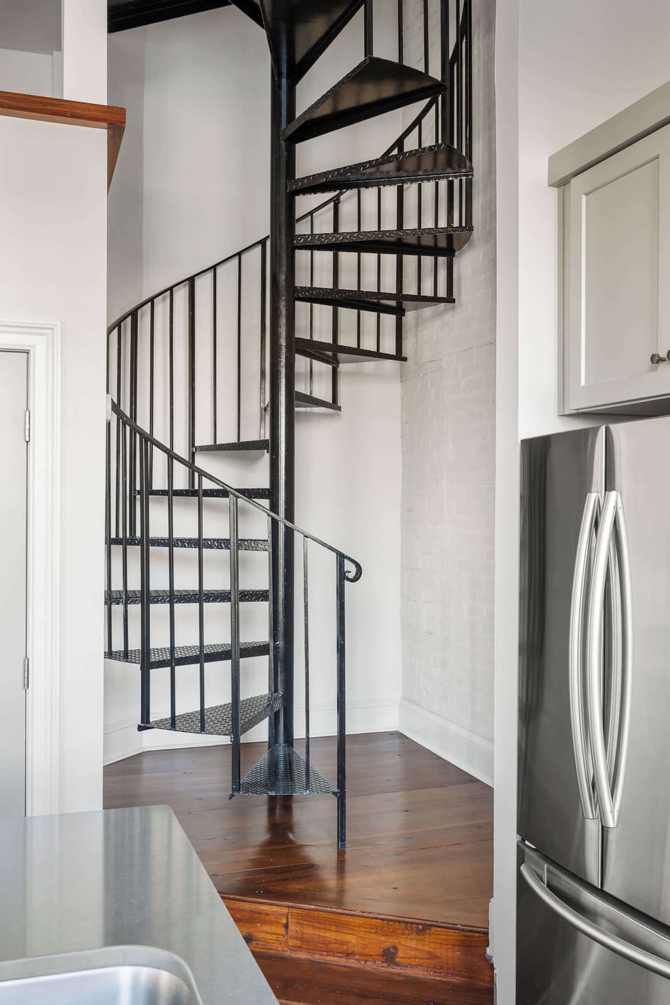 Spiral Staircase inside the condo leading to the bedrooms 