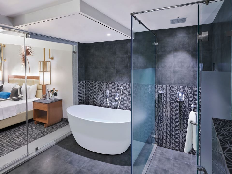 Lillian Suite | Bathroom | Free toiletries, hair dryer, slippers, towels