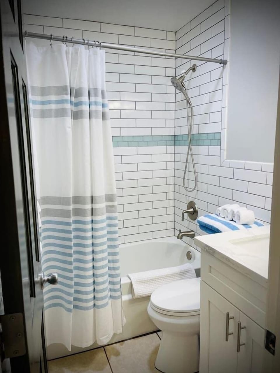 Full sized bathroom with bath tub recently renovated