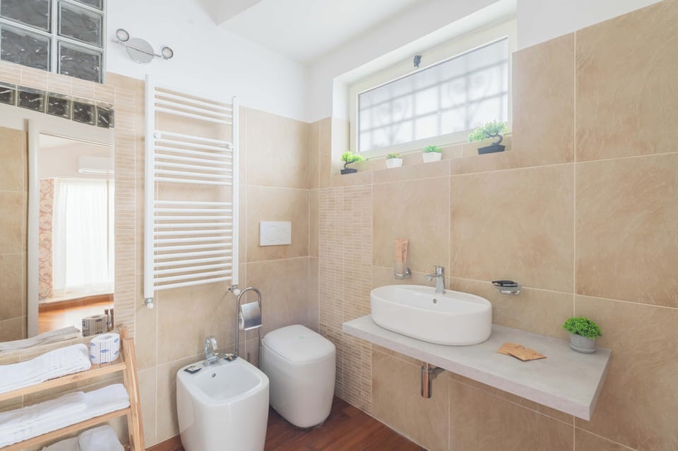 Junior Triple Room | Bathroom | Shower, eco-friendly toiletries, hair dryer, bathrobes