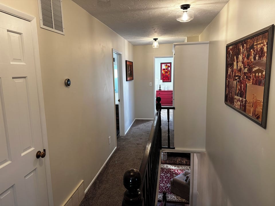 Hallway to the 3rd bathroom and two additional bedrooms