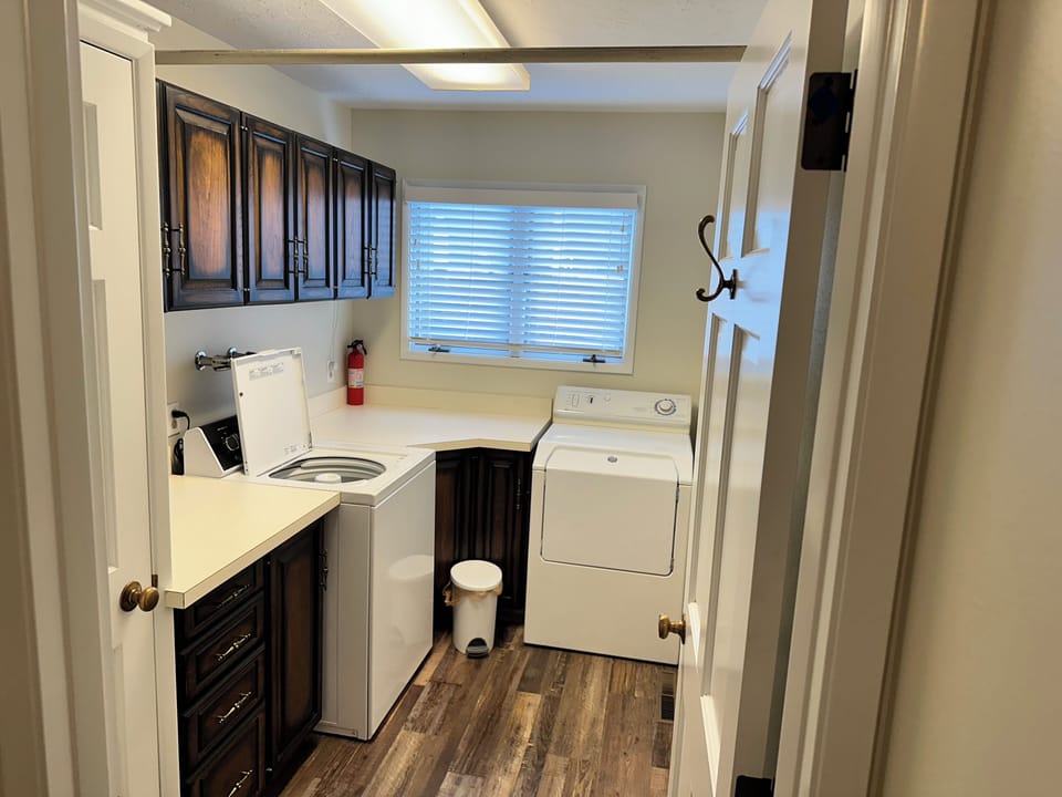 Laundry with a washer and dryer. Includes laundry detergent.