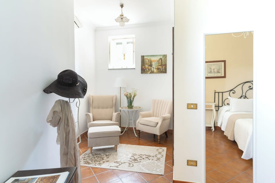 Standard Room | Living area | 32-inch flat-screen TV with cable channels