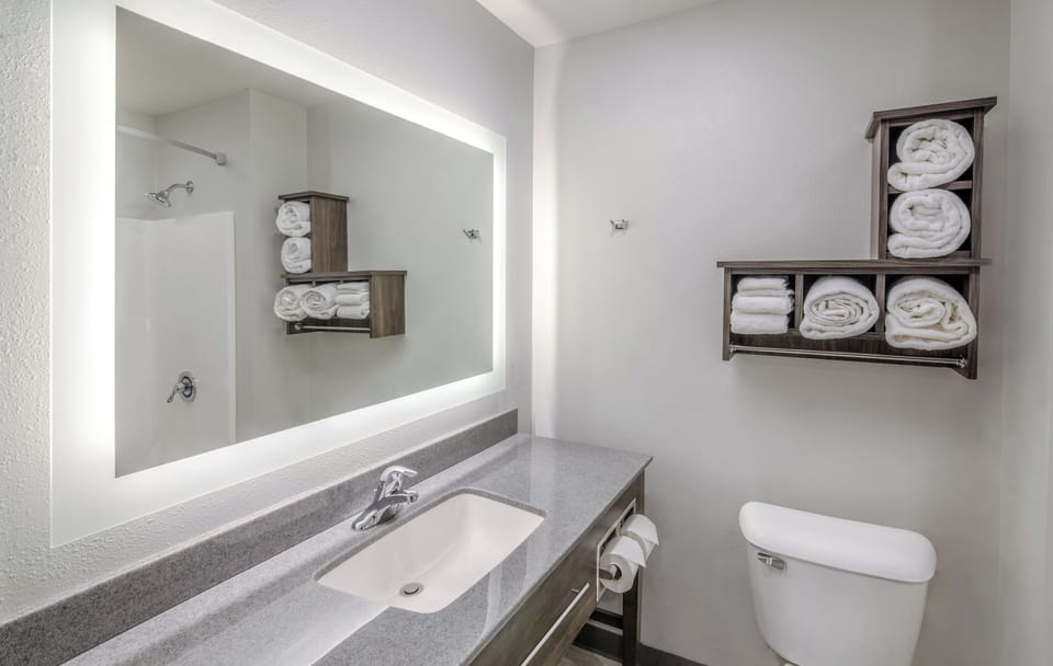 Combined shower/tub, hair dryer, towels, soap