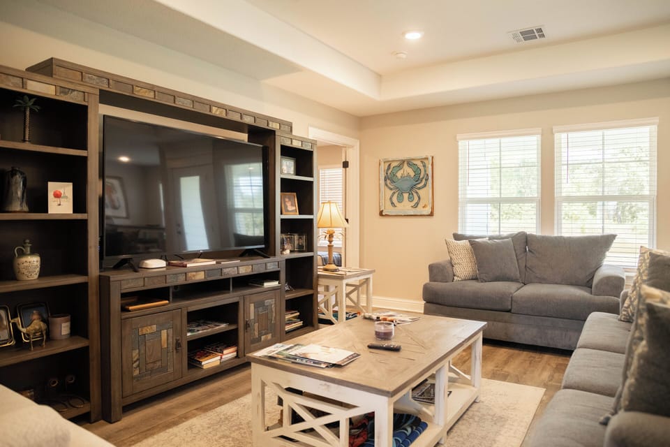 Spacious living room with large Smart TV for streaming