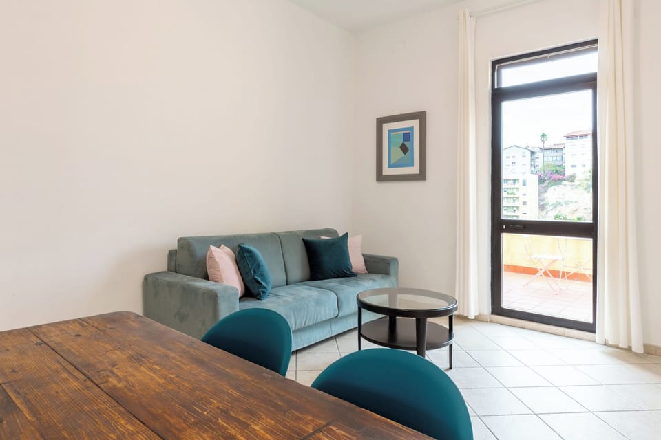 Apartment, Kitchen, City View | Living area | 32-inch Smart TV with digital channels