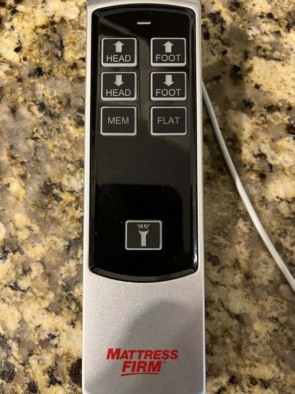 Control elevates and lowers head and foot of king bed in primary suite.