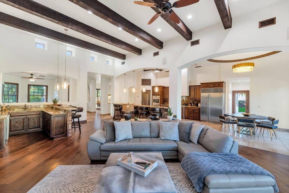 The Family Room features a Sectional sofa, 85" Smart TV & Gas Fireplace