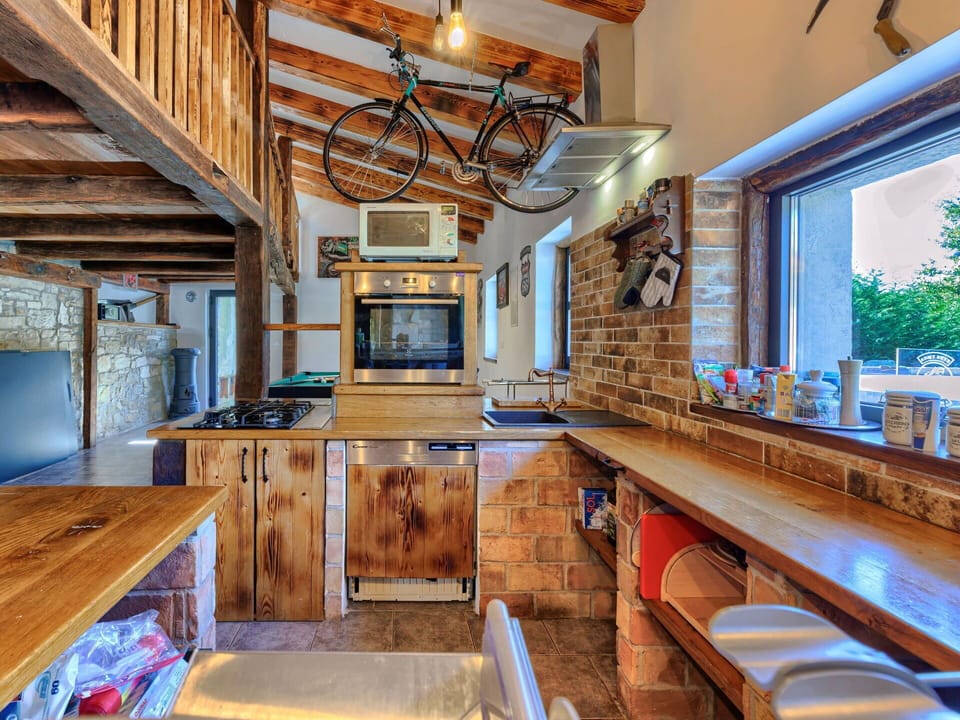 Property, Furniture, Cabinetry, Countertop, Building, Wood, Window, Kitchen, Lighting, Plant