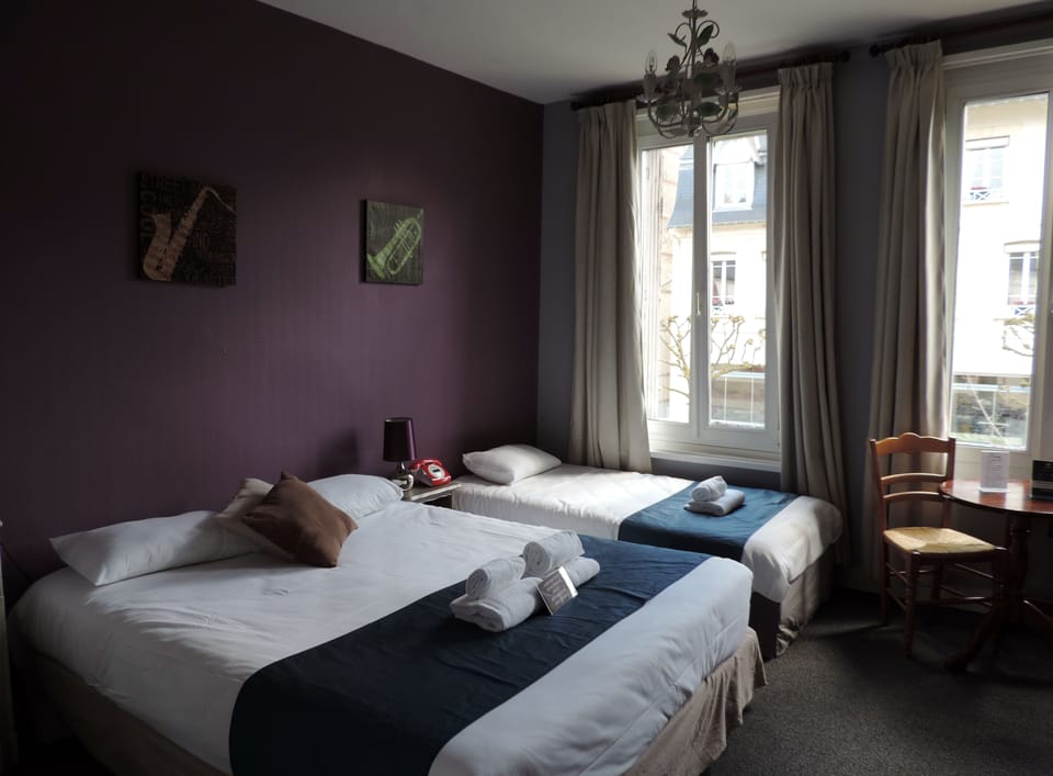 Superior Triple Room | In-room safe, desk, laptop workspace, blackout drapes