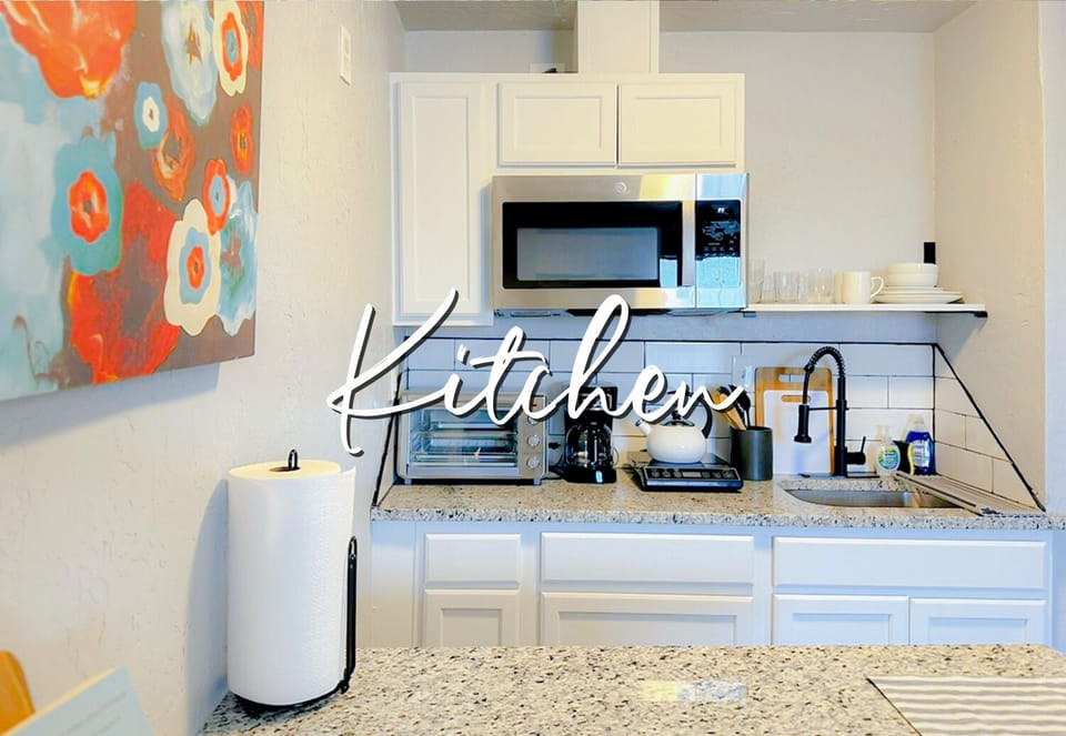 Rustic charm meets modern convenience in this beautifully designed kitchen. The perfect place to whip up a meal or simply relax with a cup of coffee.