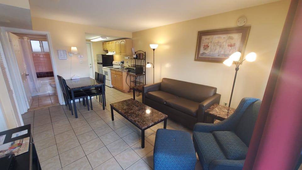 Apartment, 2 Bedrooms | Living area | 32-inch LED TV with cable channels, TV, MP3 dock