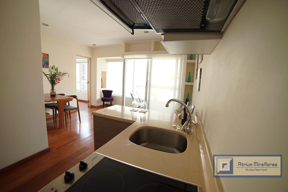 Suite, Balcony | Private kitchen | Coffee/tea maker, mini-fridge, microwave, electric kettle