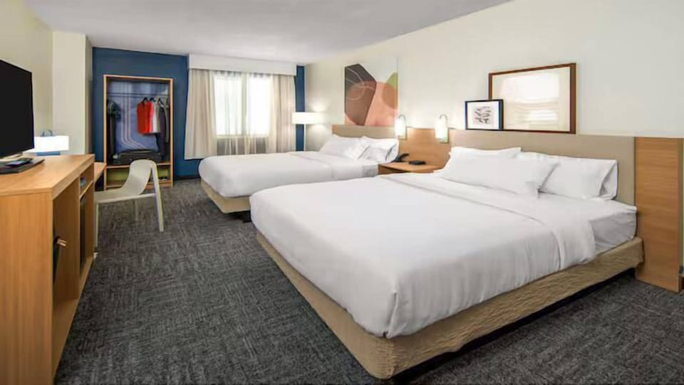 Premium bedding, desk, blackout drapes, iron/ironing board