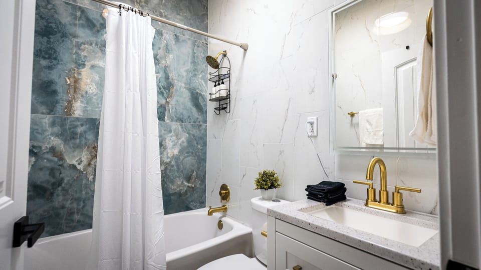 Stylish Bathroom Retreat: Indulge in modern fixtures and elegant Marble accents