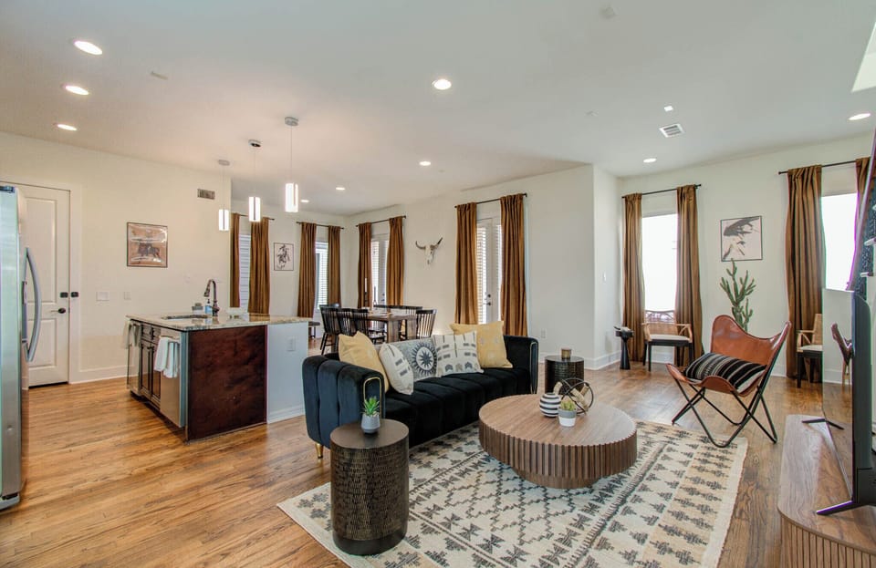 Living room in an open floor plan concept with the kitchen and dining area