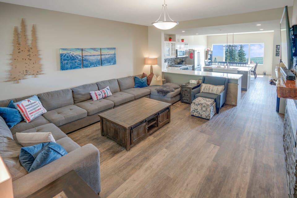 Kitchen is located at the back of the living room area.