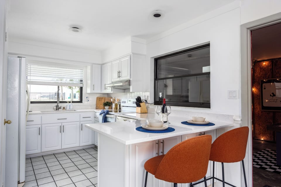 Kitchen with kitchen island and bar seating for 2