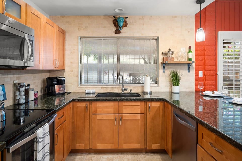 Our kitchen's black granite countertops add a touch of sophistication and durability