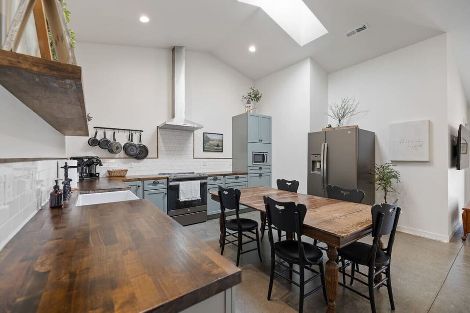 The fully stocked kitchen and spacious dining area provide everything you need for home-cooked meals and gathering with loved ones.