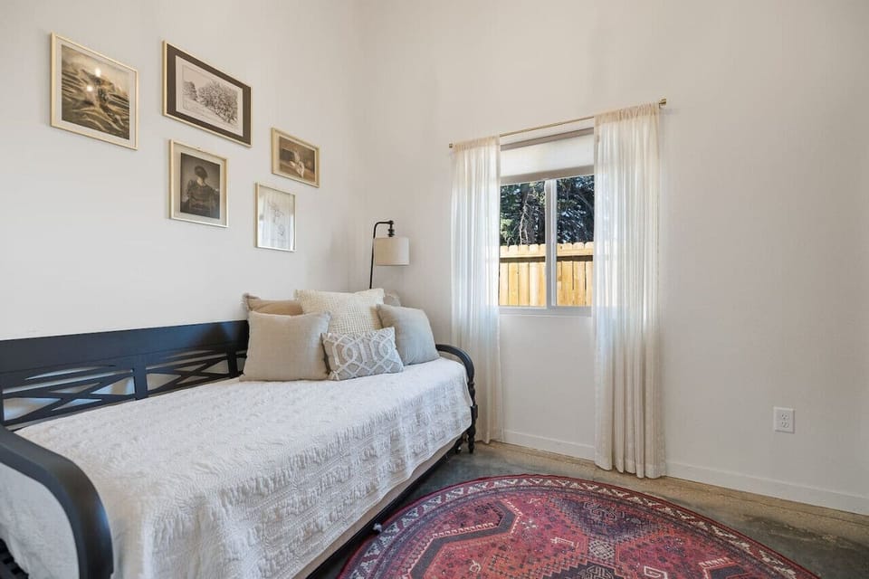 Bedroom 3 features a versatile trundle bed, making it perfect for accommodating additional guests while providing a cozy and comfortable sleeping arrangement.