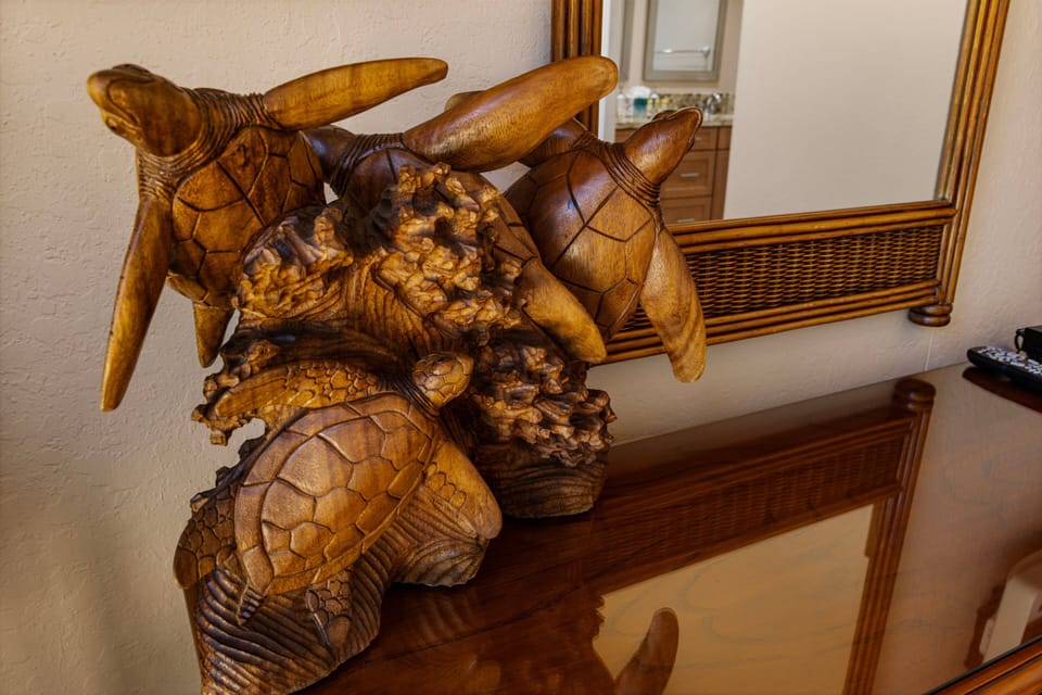 This stunning wooden sea turtle sculpture adds an artistic and tropical touch to your stay, offering a unique piece of Hawaiian craftsmanship that blends with the beachside ambiance.