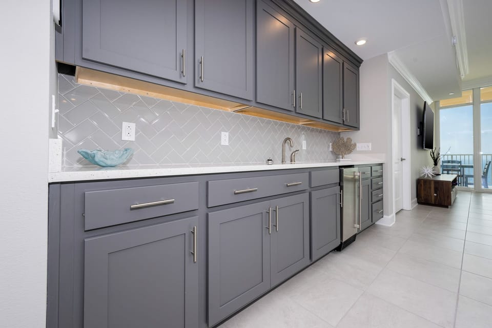Grab a chilled drink from the fridge or create your favorite cocktail at the wet bar