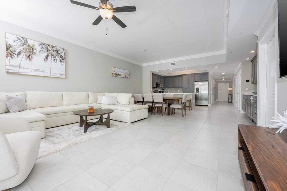 Gather in this welcoming living space and enjoy stunning beach views through the windows