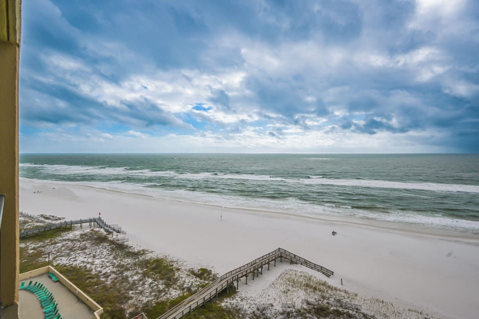 Experience breathtaking views from your balcony overlooking the serene beach, perfect for relaxation and unwinding