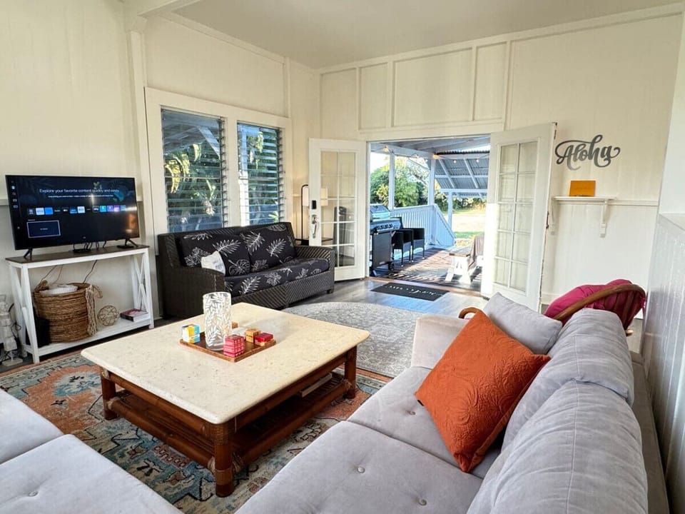 French doors connect the covered lanai and Living Room