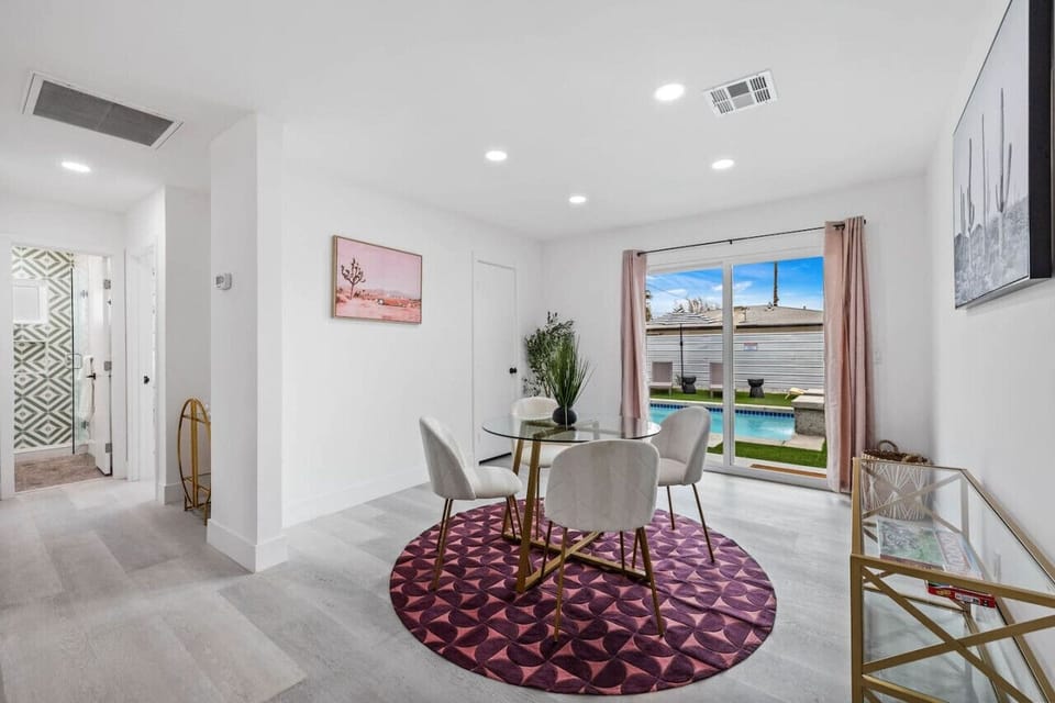 Dining area flows into the living space, offering an open layout made for gathering & entertaining.