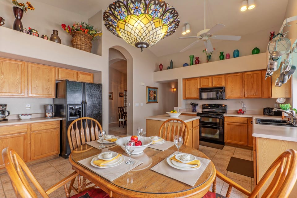 Completely stocked kitchen includes table seating for 4.