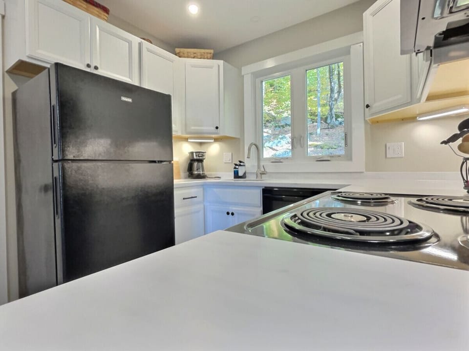 Kitchen includes stove and refrigerator for your convenience.