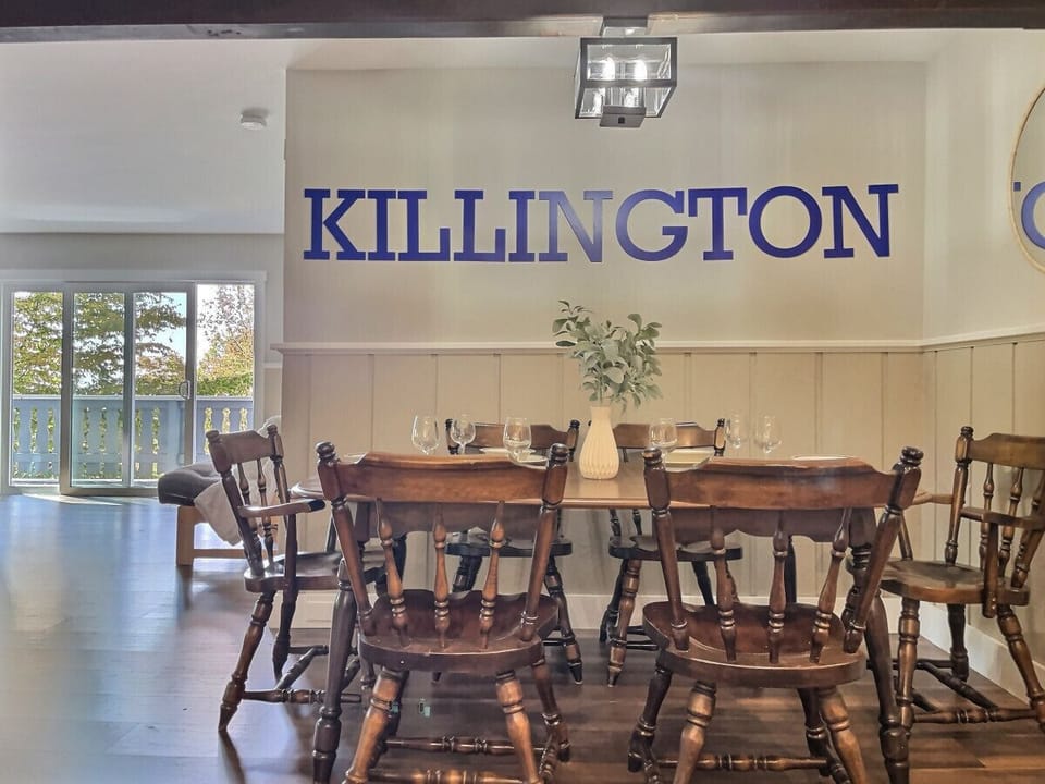Comfortable dining space with a sturdy wooden table.