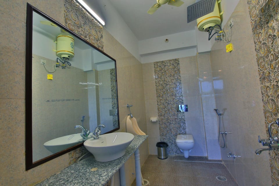 Shower, hair dryer, slippers, towels