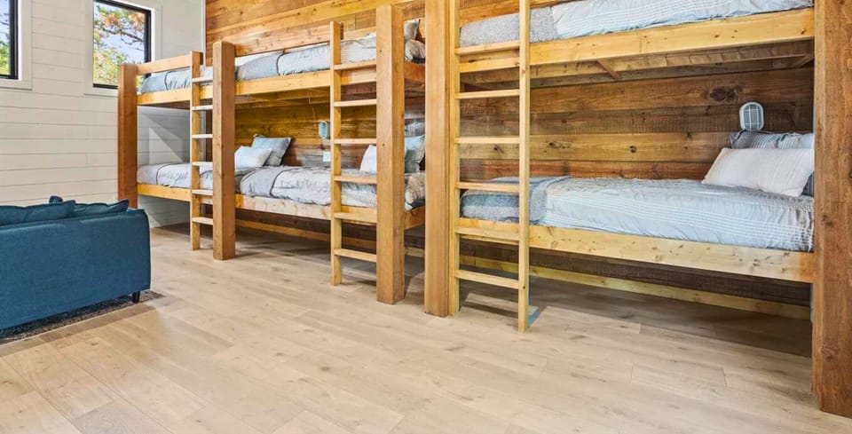 The ultimate bunk room experience! Bedroom 7 features an array of single beds ready for storytelling and late-night chats."