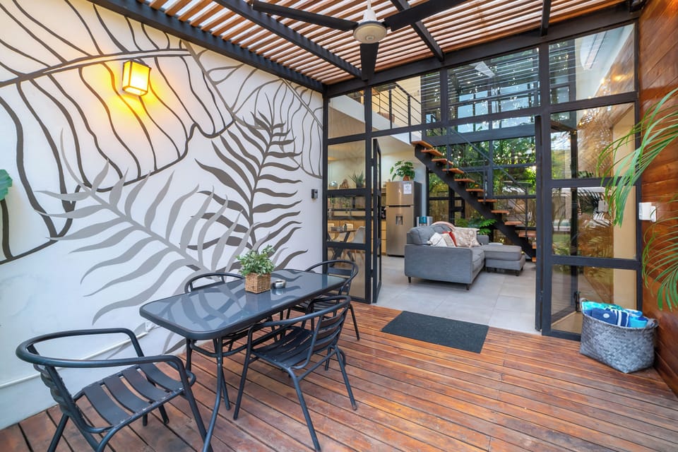 Covered front deck with seating for four