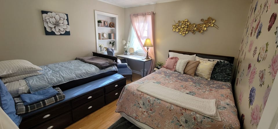Queen bed, 2 twin beds, desk, wingback chair, closet, bookshelf, 
