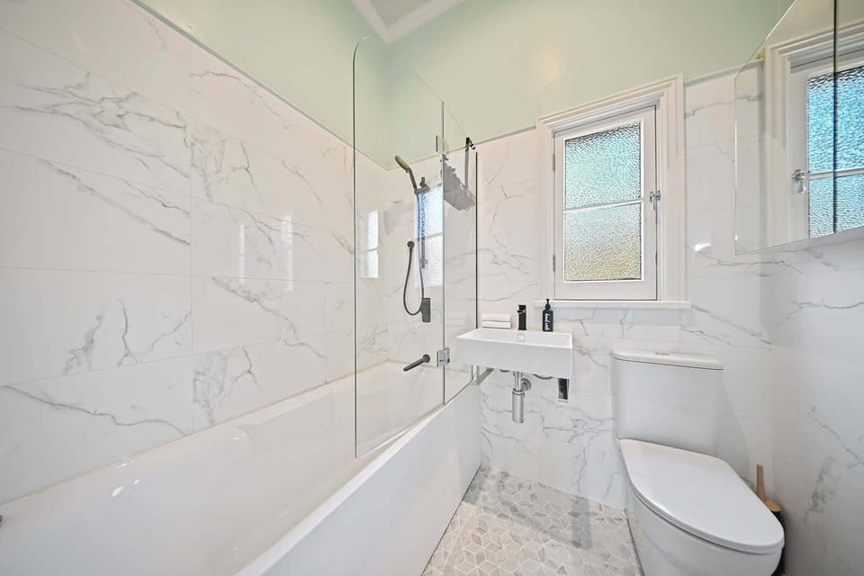 Bathroom - Shower/Bathtub, Toilet + Hair Dryer