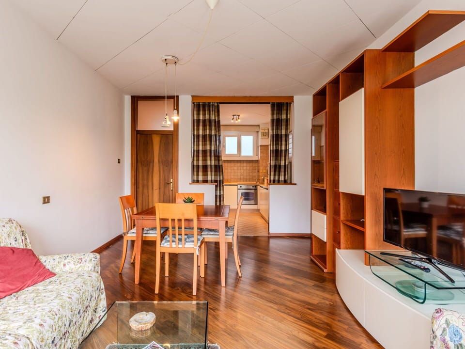 Furniture, Cabinetry, Table, Wood, Couch, Orange, Interior Design, Flooring, Television, Floor