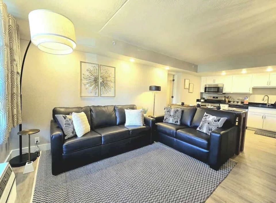 Elegant leather seating which converts to queen bed