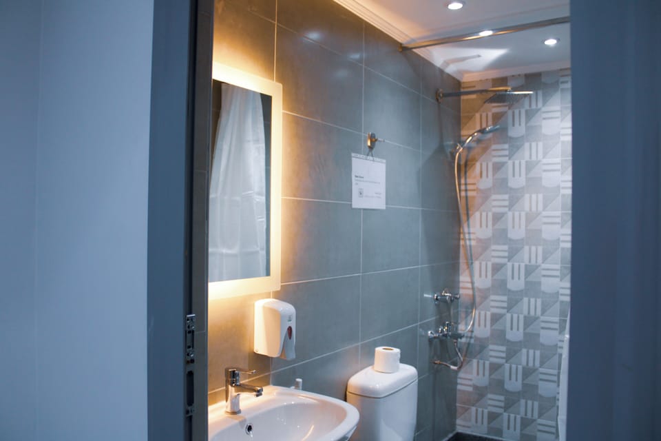 Separate tub and shower, towels, soap, toilet paper