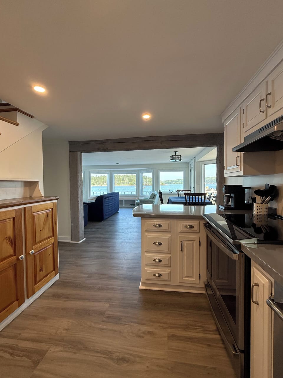 Kitchen looking into living room and dining room areas