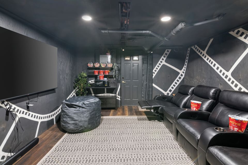 The downstairs theater room! Reclining theater seats, 75” TV with surround sound