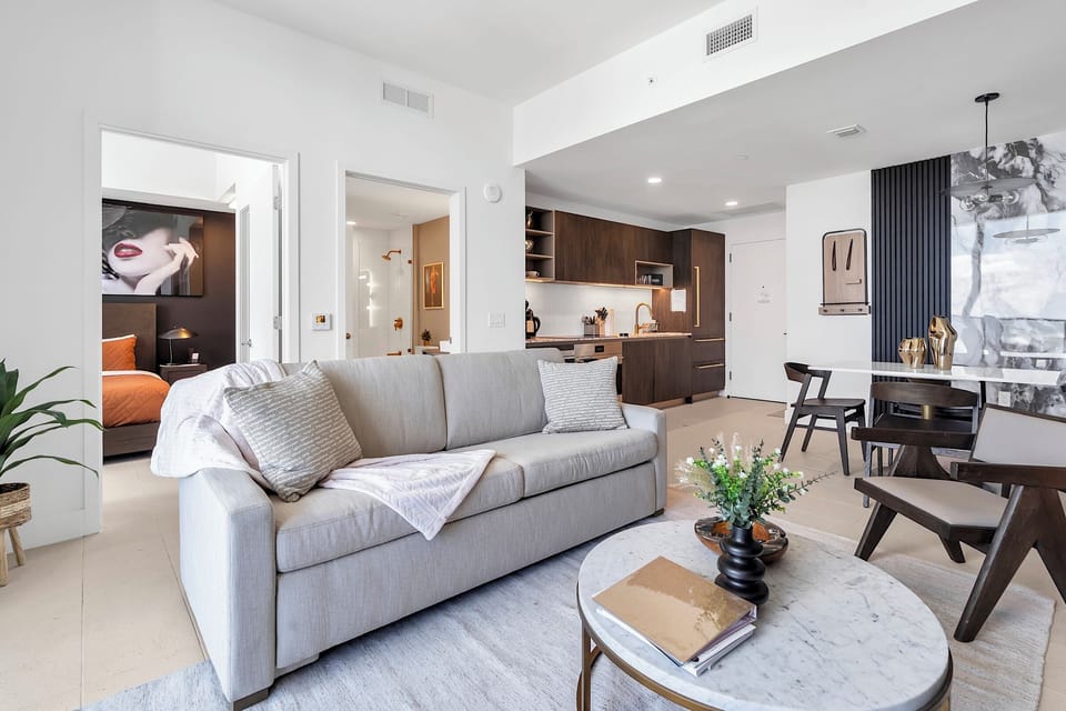 Living room with a comfy sofa, armchair, and a stylish coffee table.